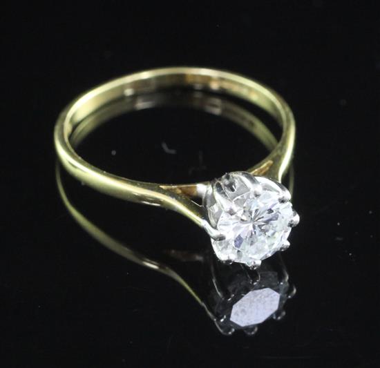 An 18ct gold and solitaire diamond ring, size M.
